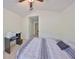 Bedroom with bed, desk, printer, and closet access at 4916 Chatham Gate Dr, Riverview, FL 33578