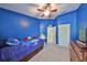 Cheerful ' bedroom in blue with ceiling fan, and a play tent at 4916 Chatham Gate Dr, Riverview, FL 33578