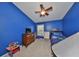 Brightly painted ' room with ceiling fan, window, dresser, and a whimsical play tent at 4916 Chatham Gate Dr, Riverview, FL 33578