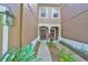 Close-up of a quaint townhome entrance with a welcoming front door and charming curb appeal at 4916 Chatham Gate Dr, Riverview, FL 33578