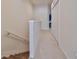 Bright hallway with wood and carpeted floors leads to upper level bedrooms and closets at 4916 Chatham Gate Dr, Riverview, FL 33578