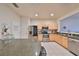 Bright kitchen featuring stainless steel appliances, tile flooring, and modern countertops at 4916 Chatham Gate Dr, Riverview, FL 33578