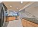 Open kitchen with stainless steel appliances flowing into the living room and an adjoining staircase at 4916 Chatham Gate Dr, Riverview, FL 33578