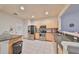 A well-lit kitchen with stainless appliances and an efficient layout, ideal for culinary activities at 4916 Chatham Gate Dr, Riverview, FL 33578