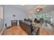 Comfortable living room with a ceiling fan, patio access, and a full living room set at 4916 Chatham Gate Dr, Riverview, FL 33578