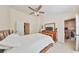 Comfortable main bedroom with a ceiling fan and closet storage at 4916 Chatham Gate Dr, Riverview, FL 33578