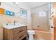 A clean bathroom features a vanity, commode, and bathtub with shower at 525 Lillian Dr, Madeira Beach, FL 33708