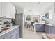 Modern kitchen with updated appliances, stylish countertops, and a view to the backyard at 525 Lillian Dr, Madeira Beach, FL 33708