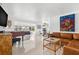 Inviting living room with a comfortable leather sofa and a beautiful view of the water at 525 Lillian Dr, Madeira Beach, FL 33708