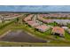 An aerial view of numerous single Gathering homes in a well-planned community with several retention ponds at 5329 Windy Grove Dr, Wimauma, FL 33598
