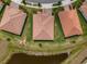 Aerial view showcases this single-Gathering home with well-maintained lawn and mature landscaping near a pond at 5329 Windy Grove Dr, Wimauma, FL 33598