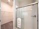 Bathroom featuring glass shower, shower caddy, and linen closet at 5329 Windy Grove Dr, Wimauma, FL 33598
