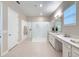 Elegant bathroom with walk-in shower, double sinks, and quartz countertops for a luxurious spa-like experience at 5329 Windy Grove Dr, Wimauma, FL 33598
