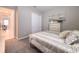 Bedroom featuring soft carpet, a dresser, and a large window at 5329 Windy Grove Dr, Wimauma, FL 33598