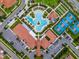 An aerial image shows a clubhouse, tennis courts, and a pool in a symmetrical geometric layout at 5329 Windy Grove Dr, Wimauma, FL 33598