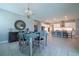 Dining area showcasing modern furniture, neutral decor, and seamless integration with the kitchen at 5329 Windy Grove Dr, Wimauma, FL 33598