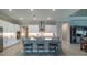 Modern kitchen featuring white cabinets, stainless steel appliances, large center island, and ample counter space at 5329 Windy Grove Dr, Wimauma, FL 33598
