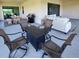Spacious outdoor patio with barbecue grill, dining set and cozy seating, perfect for entertaining at 5329 Windy Grove Dr, Wimauma, FL 33598