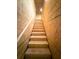 Unfinished wooden stairway leads to additional space at 5329 Windy Grove Dr, Wimauma, FL 33598