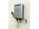 Tankless water heater on exterior wall at 5329 Windy Grove Dr, Wimauma, FL 33598