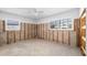 A large bedroom is ready for remodeling and features large windows that let in natural light at 5921 Denver Ne St, St Petersburg, FL 33703