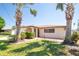Charming single-story home with a well-manicured lawn and beautiful mature palm trees in the front yard at 5921 Denver Ne St, St Petersburg, FL 33703