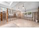 Large living room undergoing remodeling with exposed framing and new flooring tiles at 5921 Denver Ne St, St Petersburg, FL 33703