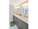 Elegant bathroom with double vanity, quartz countertops and sleek fixtures at 6035 Sea Ranch Dr # 612, Hudson, FL 34667