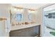 Elegant bathroom with double vanity, quartz countertops and sleek fixtures at 6035 Sea Ranch Dr # 612, Hudson, FL 34667