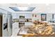 Bright kitchen with stainless steel appliances, white cabinetry, and unique granite island at 6035 Sea Ranch Dr # 612, Hudson, FL 34667