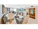 Cozy living room with balcony access and bright natural light at 6035 Sea Ranch Dr # 612, Hudson, FL 34667