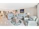 Bright and open living room with modern decor, flowing into the kitchen at 6035 Sea Ranch Dr # 612, Hudson, FL 34667