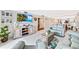 Open-concept living area with modern furnishings, views to kitchen and water at 6035 Sea Ranch Dr # 612, Hudson, FL 34667