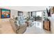 Comfortable living room with leather furnishings and balcony access offering beautiful ocean views at 6035 Sea Ranch Dr # 612, Hudson, FL 34667