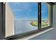Scenic water view through a large window, offering a serene and peaceful ambiance at 6035 Sea Ranch Dr # 612, Hudson, FL 34667