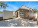 View of back of house showcasing siding, concrete pad, storage shed, and fenced yard at 6616 Northhaven Ct, Riverview, FL 33578