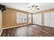 The bedroom has wood-look floors and a large window offering plenty of natural light at 6616 Northhaven Ct, Riverview, FL 33578