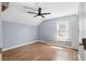 Bedroom featuring vaulted ceilings, wood floors, and natural light from the window at 6616 Northhaven Ct, Riverview, FL 33578