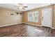 This bedroom features wood-look flooring, and a window to let in natural light at 6616 Northhaven Ct, Riverview, FL 33578