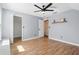 Charming bedroom with wood floors, ceiling fan, and walk-in closet at 6616 Northhaven Ct, Riverview, FL 33578