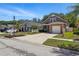 A two-story home with a one car garage, a tidy yard, and a paved driveway at 6616 Northhaven Ct, Riverview, FL 33578