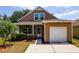 Charming two-story home featuring a well-maintained yard and an attached one car garage at 6616 Northhaven Ct, Riverview, FL 33578