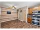 Eat-in kitchen with wooden cabinets, stainless steel appliances, and modern ceiling fan at 6616 Northhaven Ct, Riverview, FL 33578