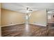 The living room offers sleek wood floors and a ceiling fan at 6616 Northhaven Ct, Riverview, FL 33578