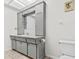 Neutral bathroom with tile flooring, a grey vanity, and plenty of cabinet space at 6790 Burning Tree Dr, Seminole, FL 33777