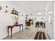 Bright foyer with tile flooring, decorative accents, and an open flow to the living and dining areas at 6790 Burning Tree Dr, Seminole, FL 33777