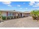 A charming home boasts a brick driveway, mature landscaping, and an attached garage at 6790 Burning Tree Dr, Seminole, FL 33777