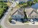 Aerial view of the townhome showing proximity to the lake, parking, and surrounding community at 6851 Breezy Palm Dr, Riverview, FL 33578