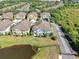 Aerial shot of the property highlighting the pond, green space, and access to parking at 6851 Breezy Palm Dr, Riverview, FL 33578