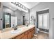 Bathroom features double vanity, tile floors, and white shower at 6851 Breezy Palm Dr, Riverview, FL 33578